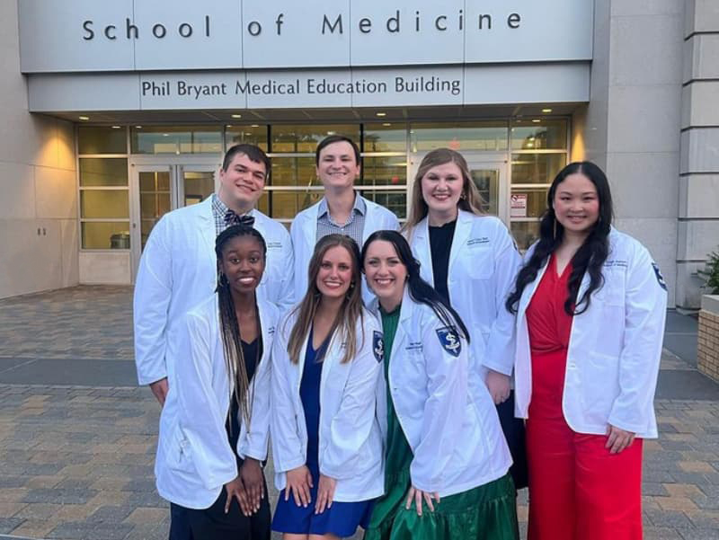 Third year students receiving their new white coats.